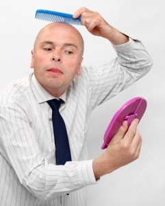 Hairless businessman with mirror - forever beautiful. ( Narcissus concept )